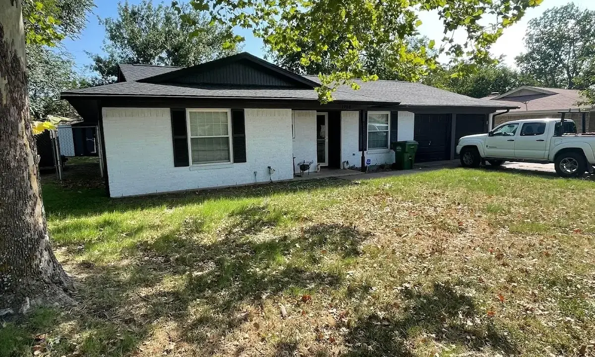 Professional roofing crew working on a residential roof in Lexington